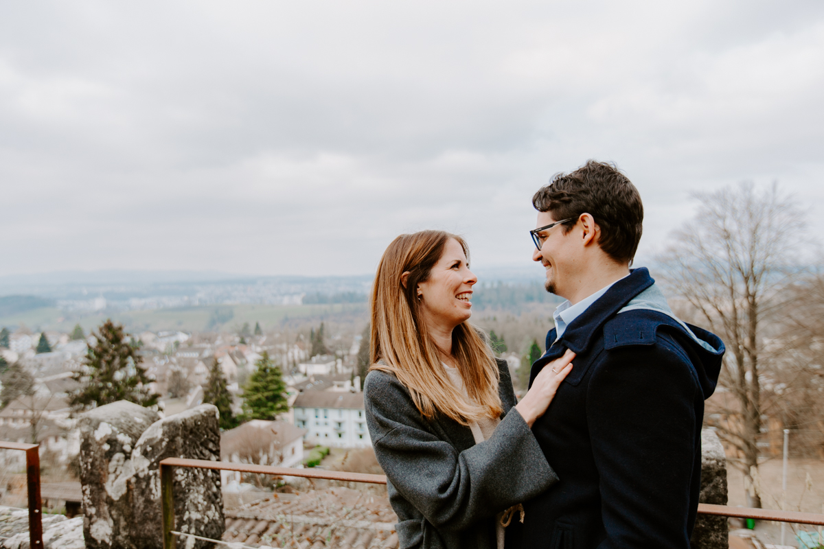 Couple cuddling on a Lucerne viewpoint