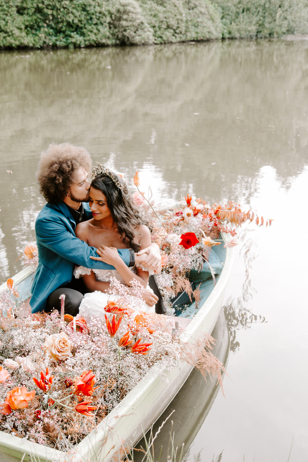 Bride and groom in boat at Shropshire wedding