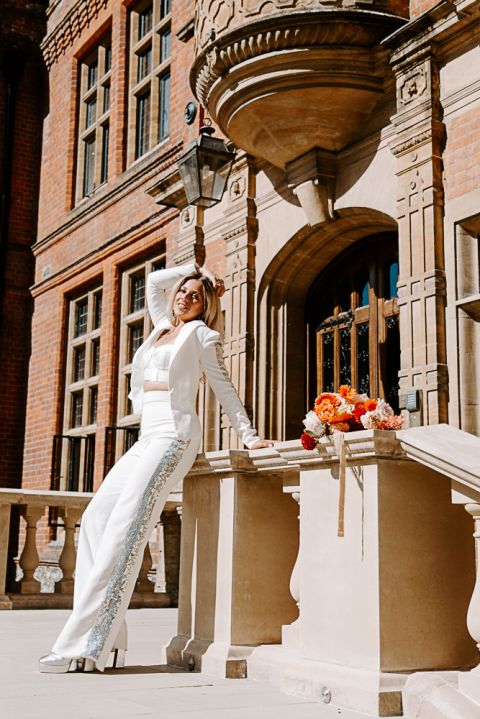 Bride wearing a suit at Woldingham School Wedding Venue in Surrey