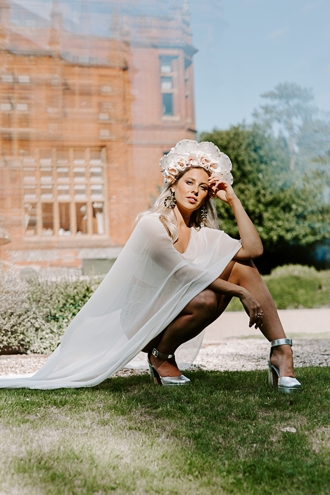 Bride in cape and headdress at Surrey wedding
