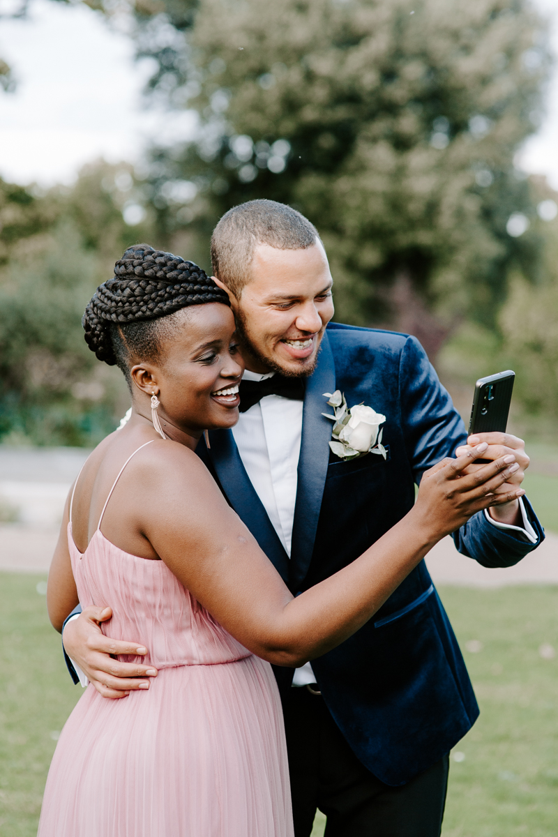 Bride and groom facetiming at COVID Wedding