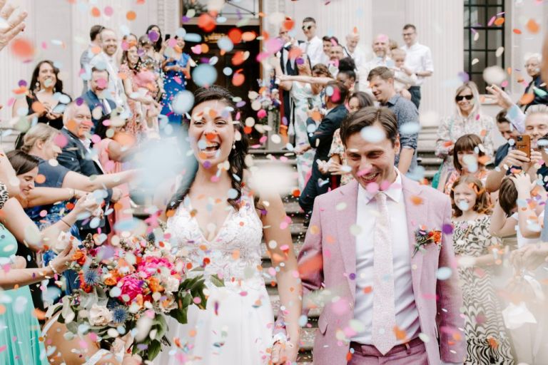 A very colourful and bright confetti moment at M&N's London wedding ceremony at the Old Marylebone Town Hall.

Colourful confetti hits differently, and you definitely can't have to much. It brought the steps of this London wedding venue to life. 